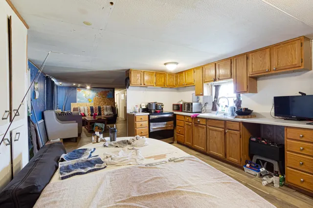 a kitchen with a sink appliances and cabinets