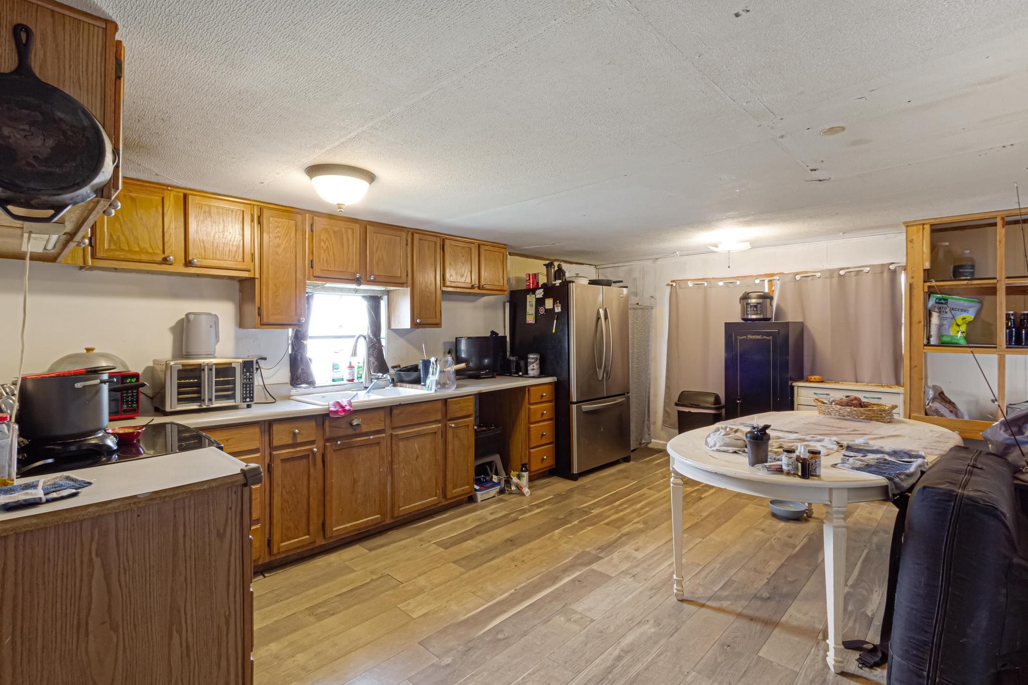 3268 E Road, Unit 1 Clifton, CO 81520 - Photo 9 of 17 a kitchen with stainless steel appliances kitchen island granite countertop a sink stove and refrigerator