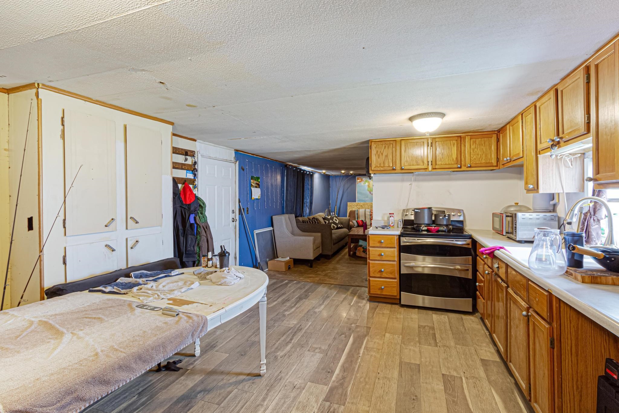 3268 E Road, Unit 1 Clifton, CO 81520 - Photo 10 of 17 a living room with furniture and a wooden floor