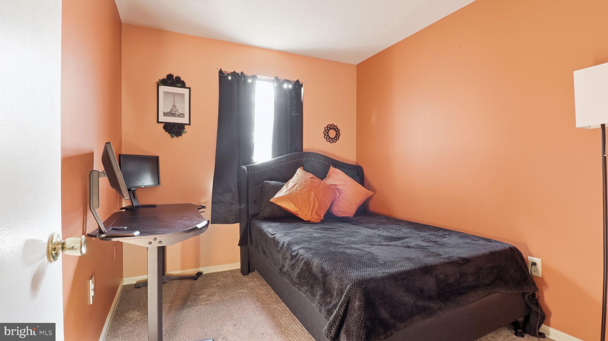 7631 South Arbory Lane, Unit 360 Laurel, MD 20707 - Photo 18 of 25 a bedroom with a bed and dresser with chair