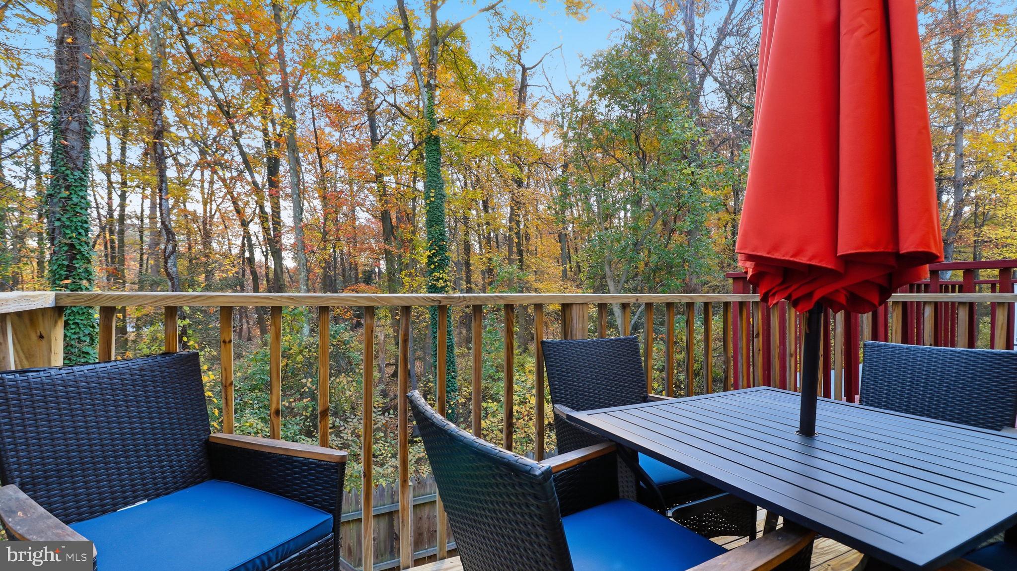 7631 South Arbory Lane, Unit 360 Laurel, MD 20707 - Photo 22 of 25 a view of a deck with wooden floor and outdoor seating
