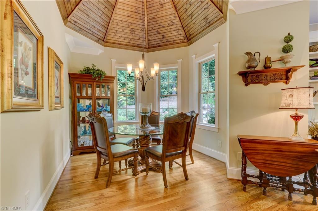 5807 Bison Drive Oak Ridge, NC 27310 - Photo 15 of 39 Breakfast room with tongue and groove gazebo ceiling. Triple Bay overlooks rear gardens.