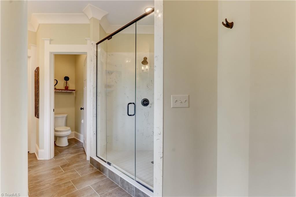 5807 Bison Drive Oak Ridge, NC 27310 - Photo 20 of 39 Separate shower with multiple heads.