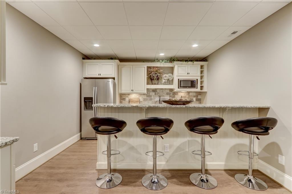 5807 Bison Drive Oak Ridge, NC 27310 - Photo 28 of 39 Very workable kitchen in lower level. Is a perfect in law suite.