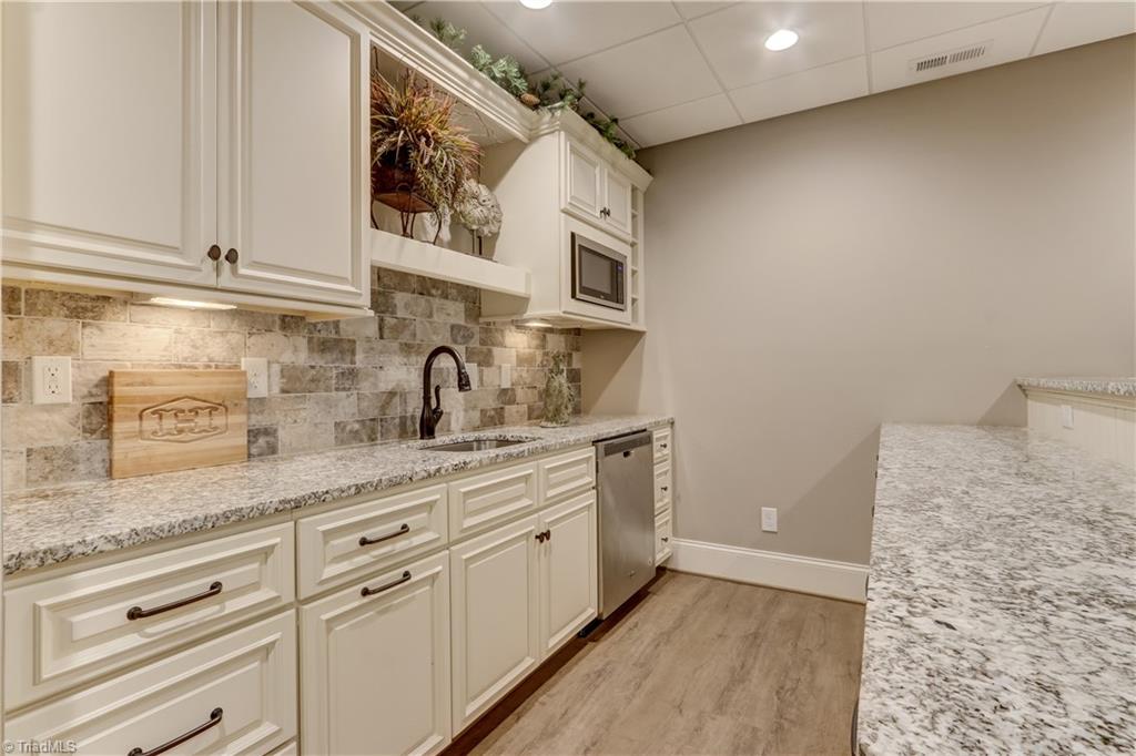 5807 Bison Drive Oak Ridge, NC 27310 - Photo 29 of 39 Another view of the lower level kitchen