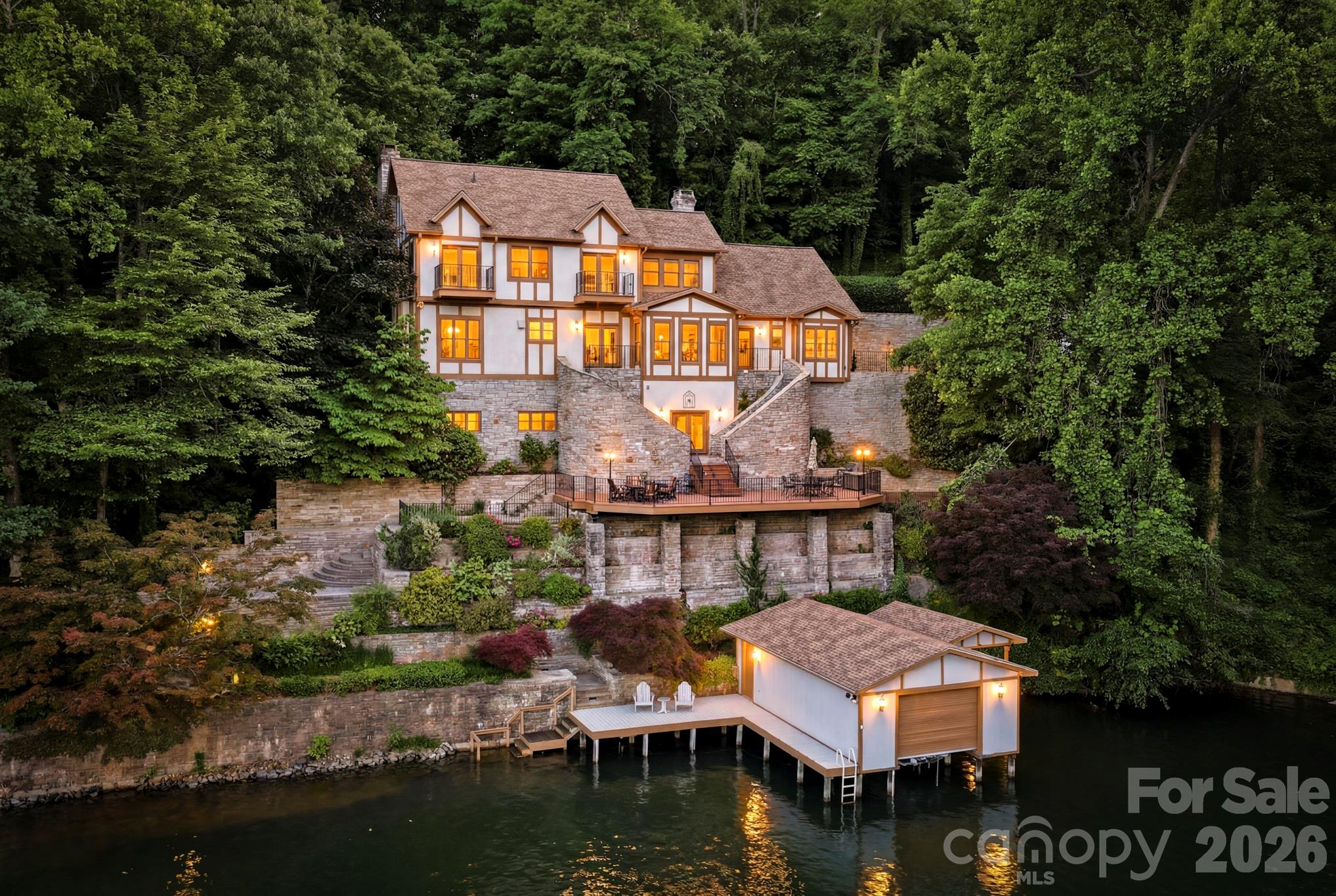 a front view of house with yard and lake view
