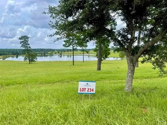 a view of a golf course with a big yard
