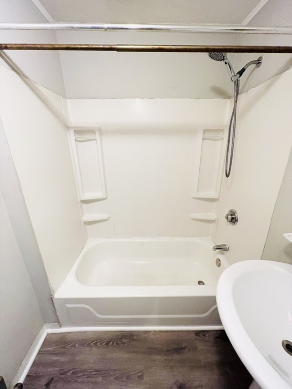 69 Adams Street, Unit 2 Boston, MA 02122 - Photo 4 of 5 a bathroom with a white bath tub and a shower