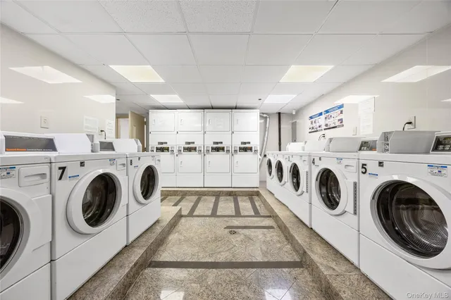 a bedroom with two beds and a television