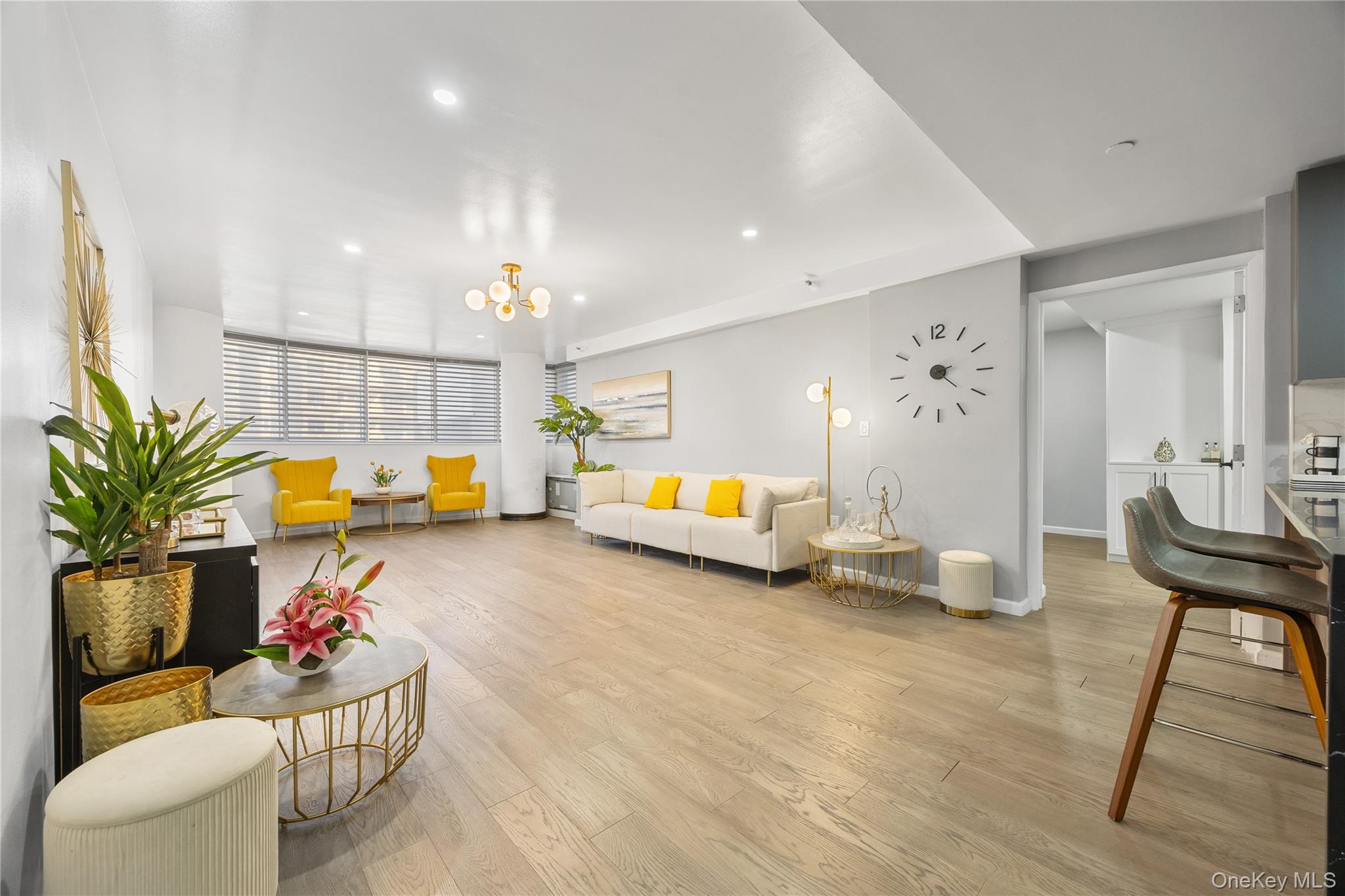 133-38 Sanford Avenue, Unit 6C Queens, NY 11355 - Photo 3 of 21 a living room with furniture and a table