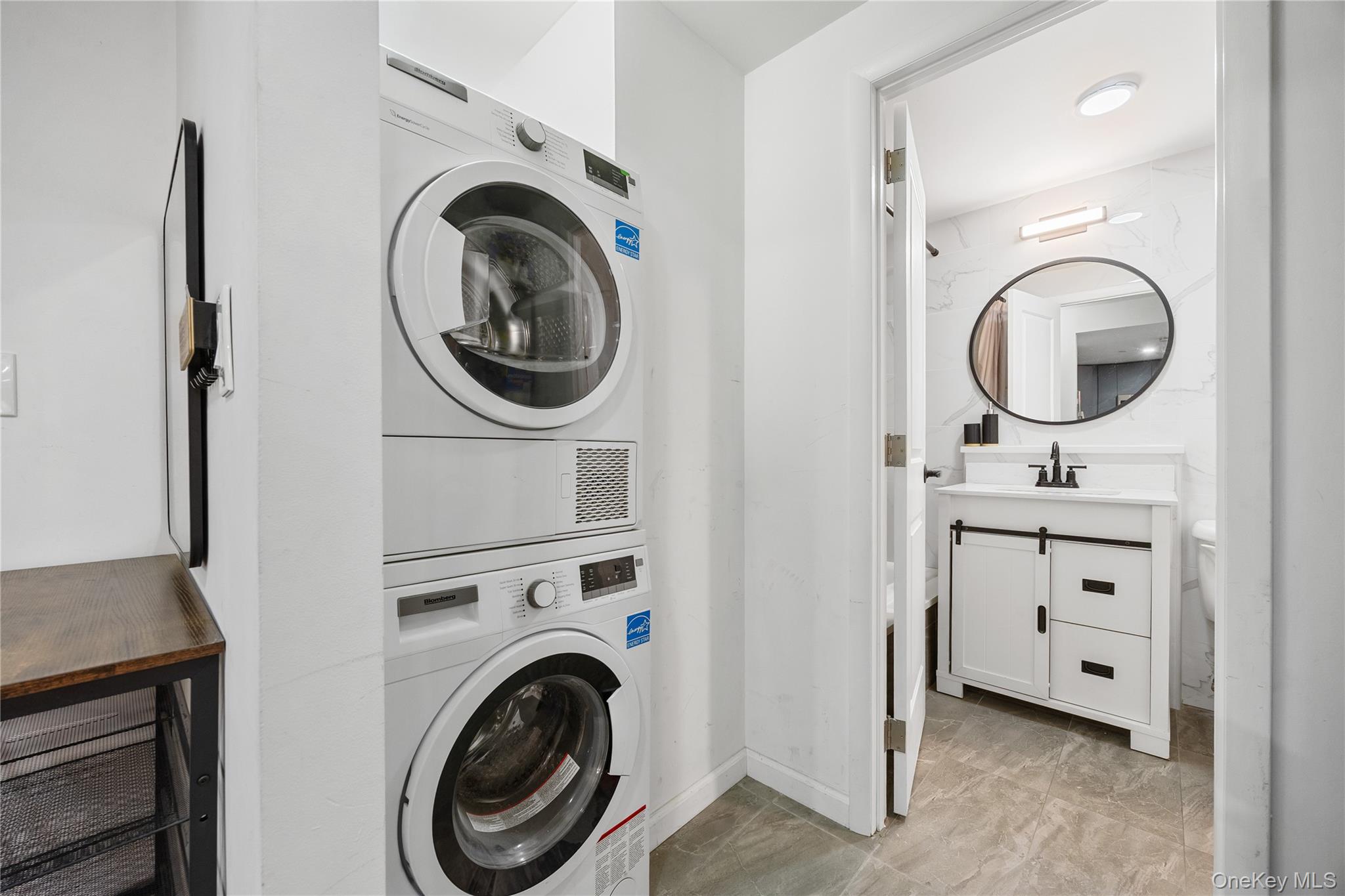 133-38 Sanford Avenue, Unit 6C Queens, NY 11355 - Photo 6 of 21 a view of a storage & utility room with washer and dryer