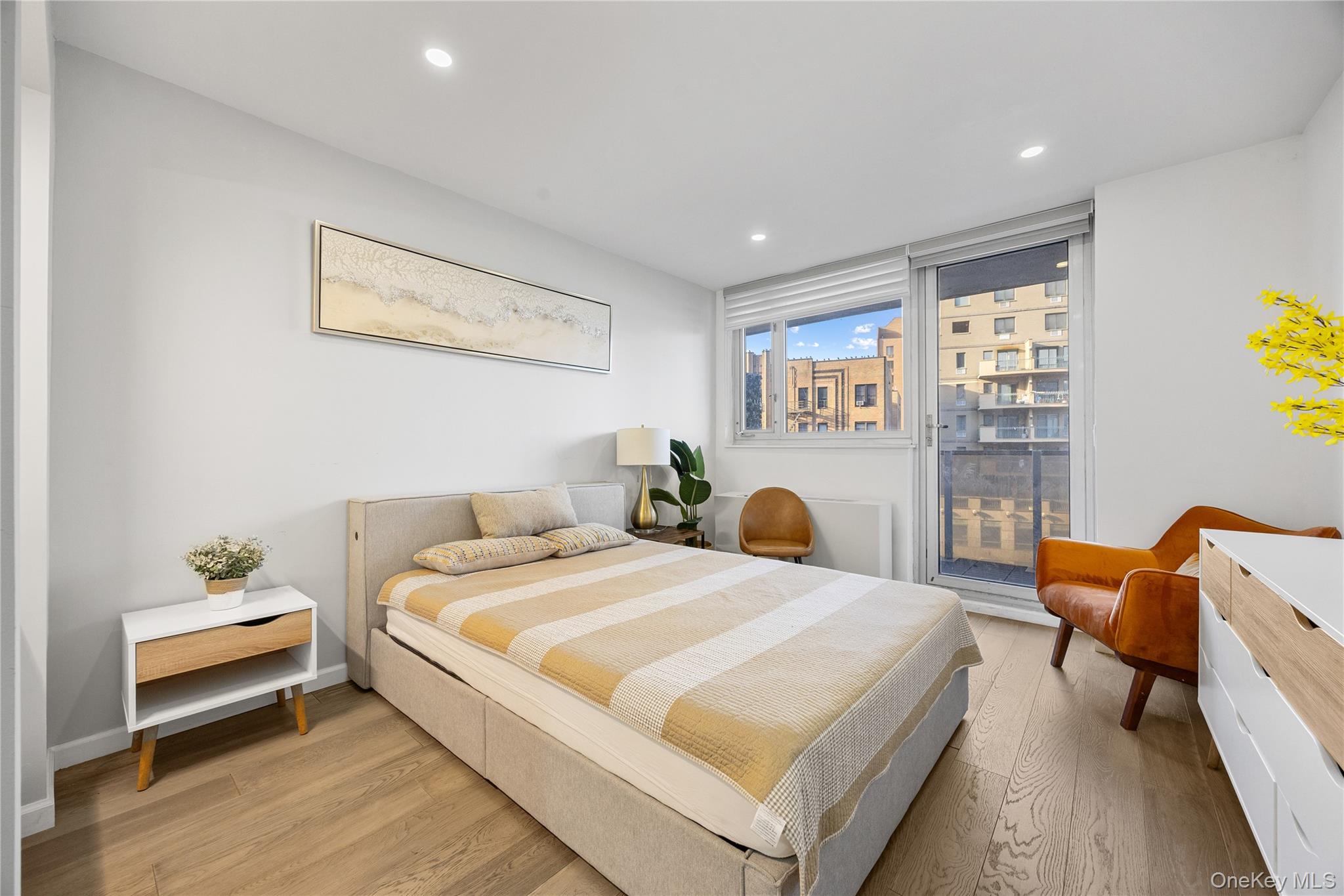 133-38 Sanford Avenue, Unit 6C Queens, NY 11355 - Photo 8 of 21 a bedroom with a bed and a window