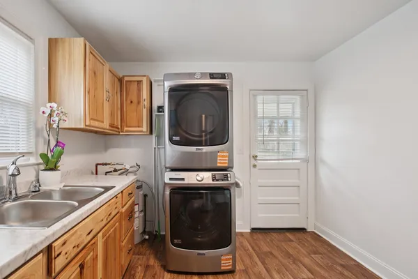 a kitchen with stainless steel appliances granite countertop a sink stove and cabinets