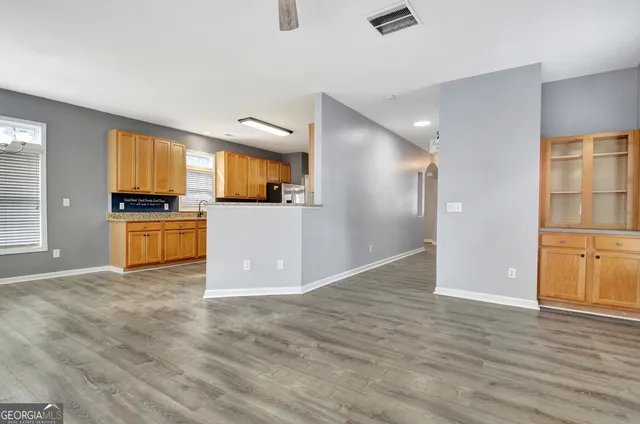 a view of a kitchen with a sink and a stove top oven