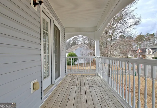 a view of a balcony with wooden floor