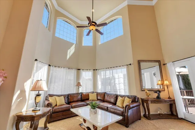 a kitchen with granite countertop a stove a sink and a microwave