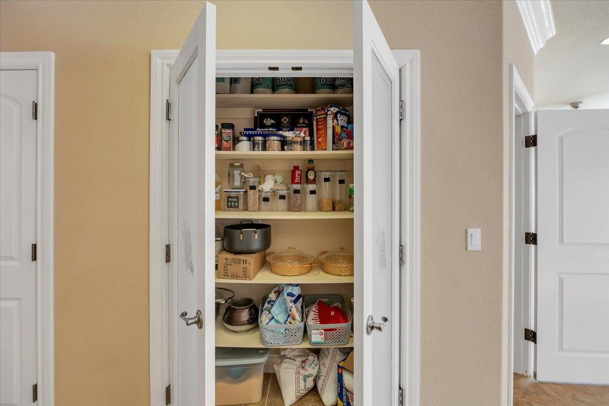 294 Sunrise Road, Unit 2 Copperopolis, CA 95228 - Photo 29 of 98 a view of walk in closet with clothes and shoes