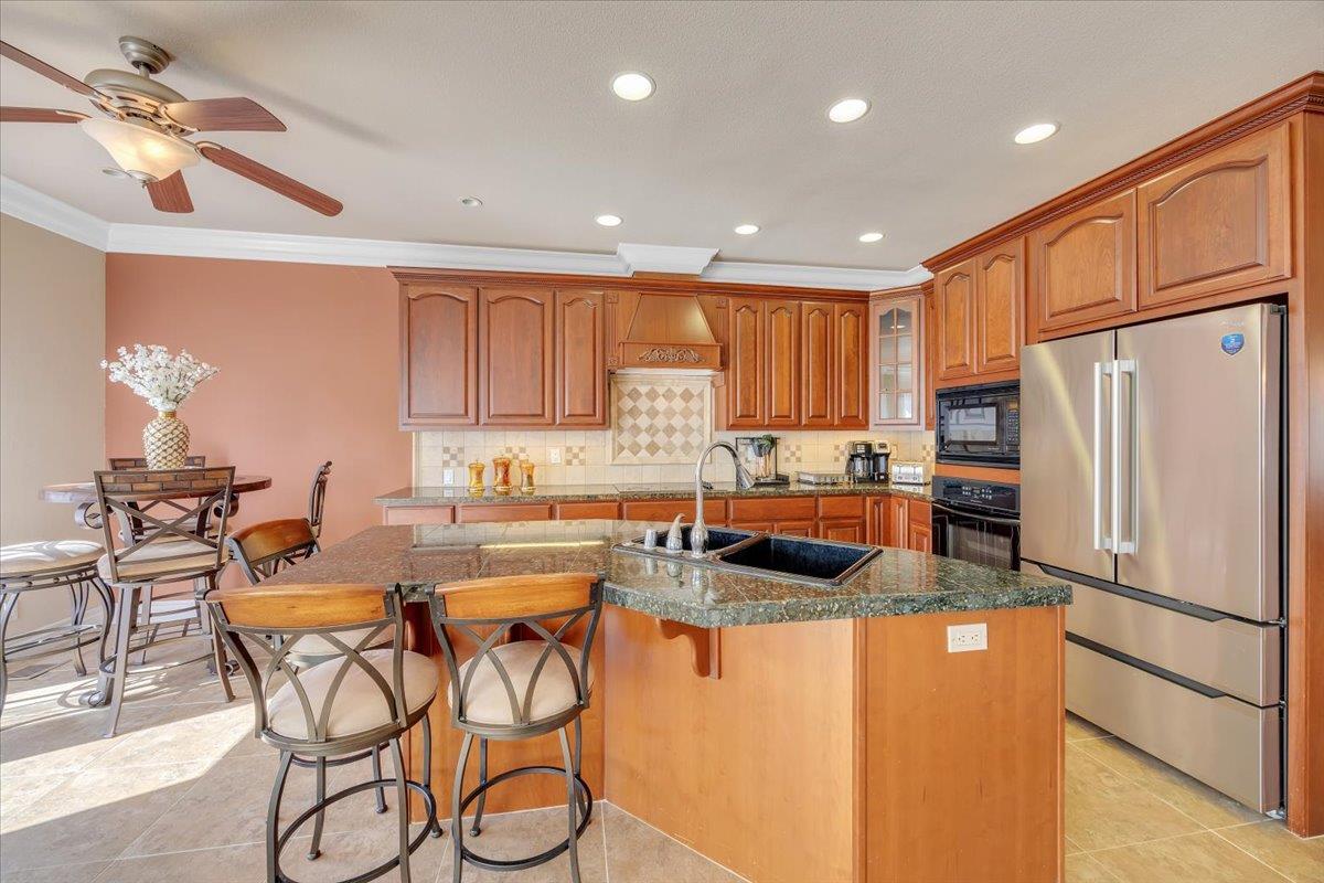 294 Sunrise Road, Unit 2 Copperopolis, CA 95228 - Photo 31 of 98 a kitchen with stainless steel appliances granite countertop a refrigerator and a stove top oven