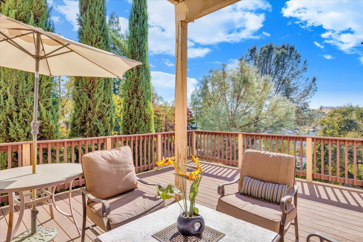 294 Sunrise Road, Unit 2 Copperopolis, CA 95228 - Photo 35 of 98 a view of a chair and tables in the balcony