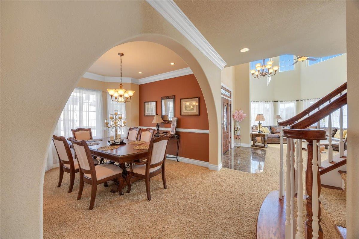 294 Sunrise Road, Unit 2 Copperopolis, CA 95228 - Photo 36 of 98 a view of a dining room with furniture and a chandelier
