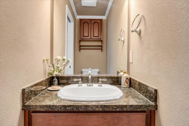 a bedroom with a bed and a lamp