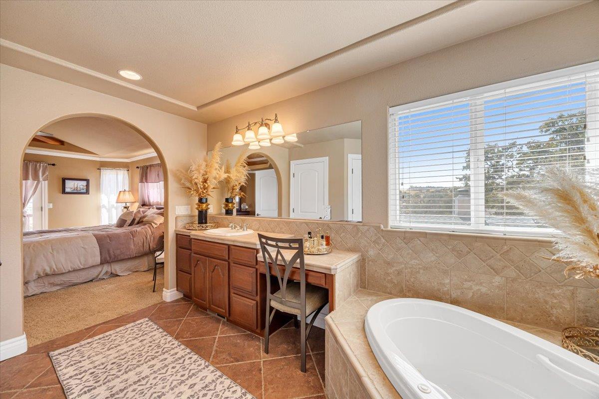 294 Sunrise Road, Unit 2 Copperopolis, CA 95228 - Photo 61 of 98 a spacious bathroom with a granite countertop tub sink and mirror