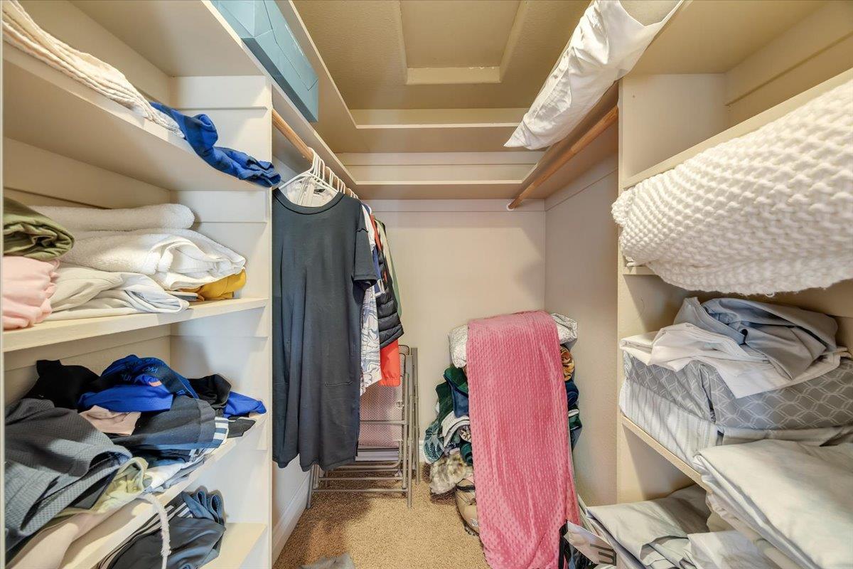 294 Sunrise Road, Unit 2 Copperopolis, CA 95228 - Photo 63 of 98 a view of walk in closet with clothes and shoes