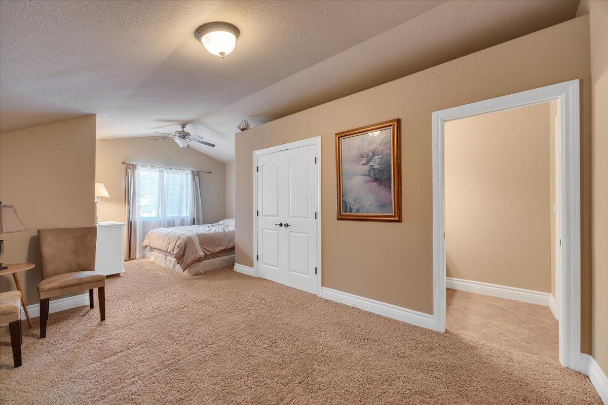 294 Sunrise Road, Unit 2 Copperopolis, CA 95228 - Photo 69 of 98 a living room with furniture and a lamp