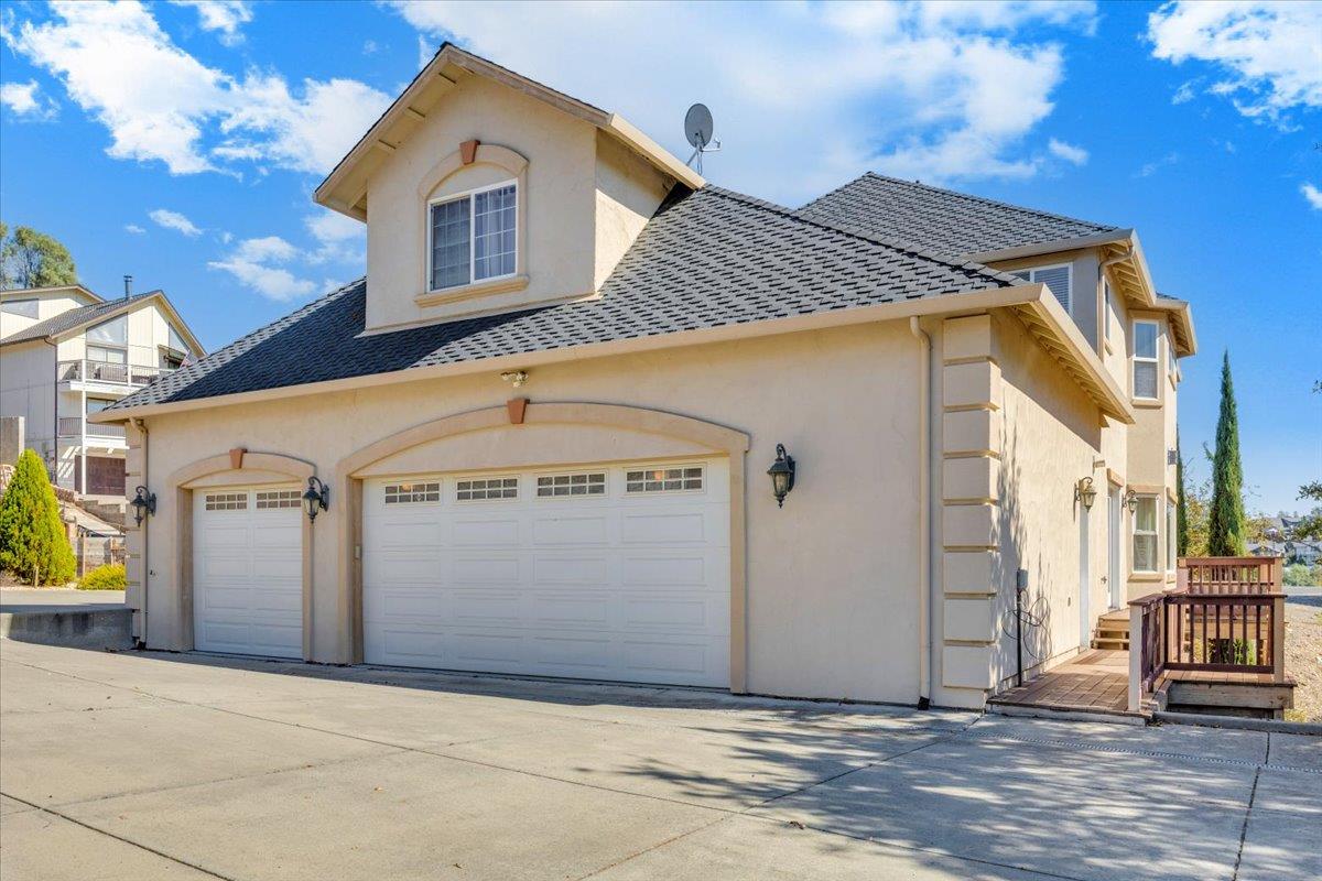294 Sunrise Road, Unit 2 Copperopolis, CA 95228 - Photo 73 of 98 a front view of a house with a garage