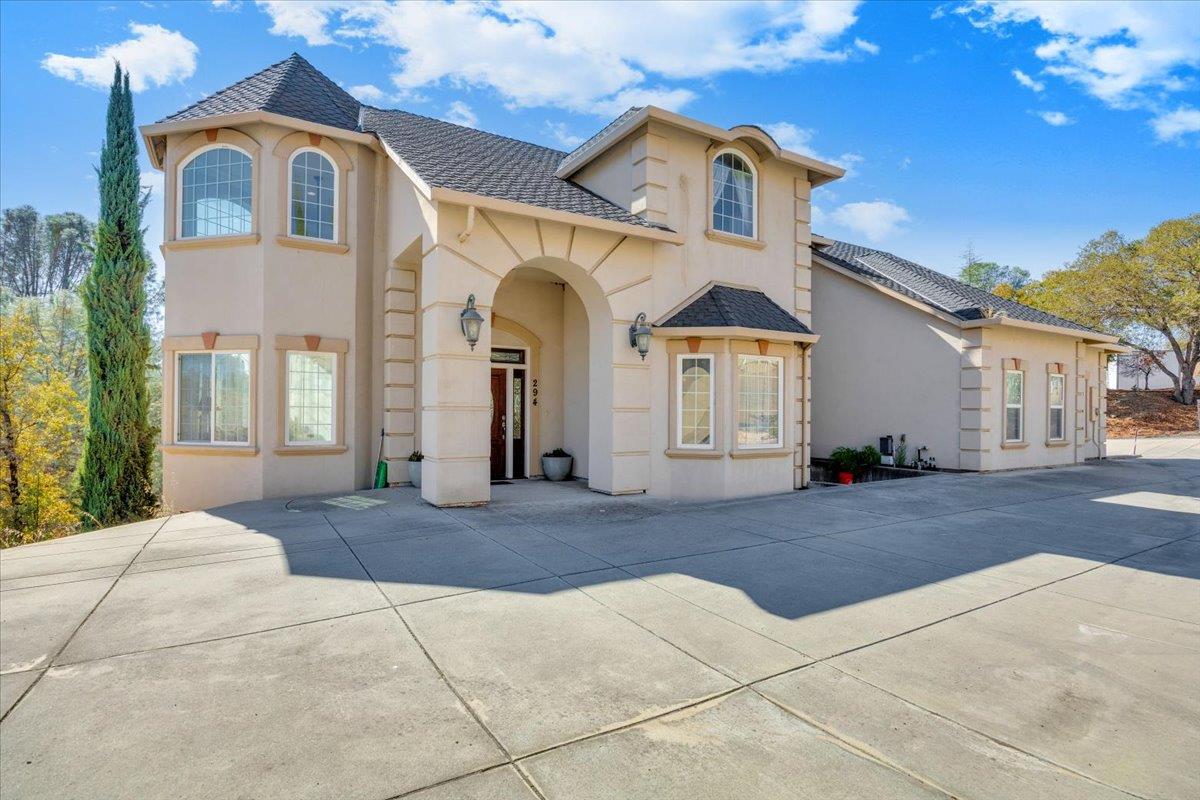 294 Sunrise Road, Unit 2 Copperopolis, CA 95228 - Photo 8 of 98 a front view of a house with a yard