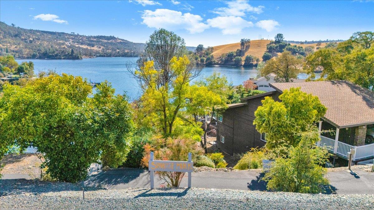 294 Sunrise Road, Unit 2 Copperopolis, CA 95228 - Photo 83 of 98 an aerial view of a house with a yard and lake view