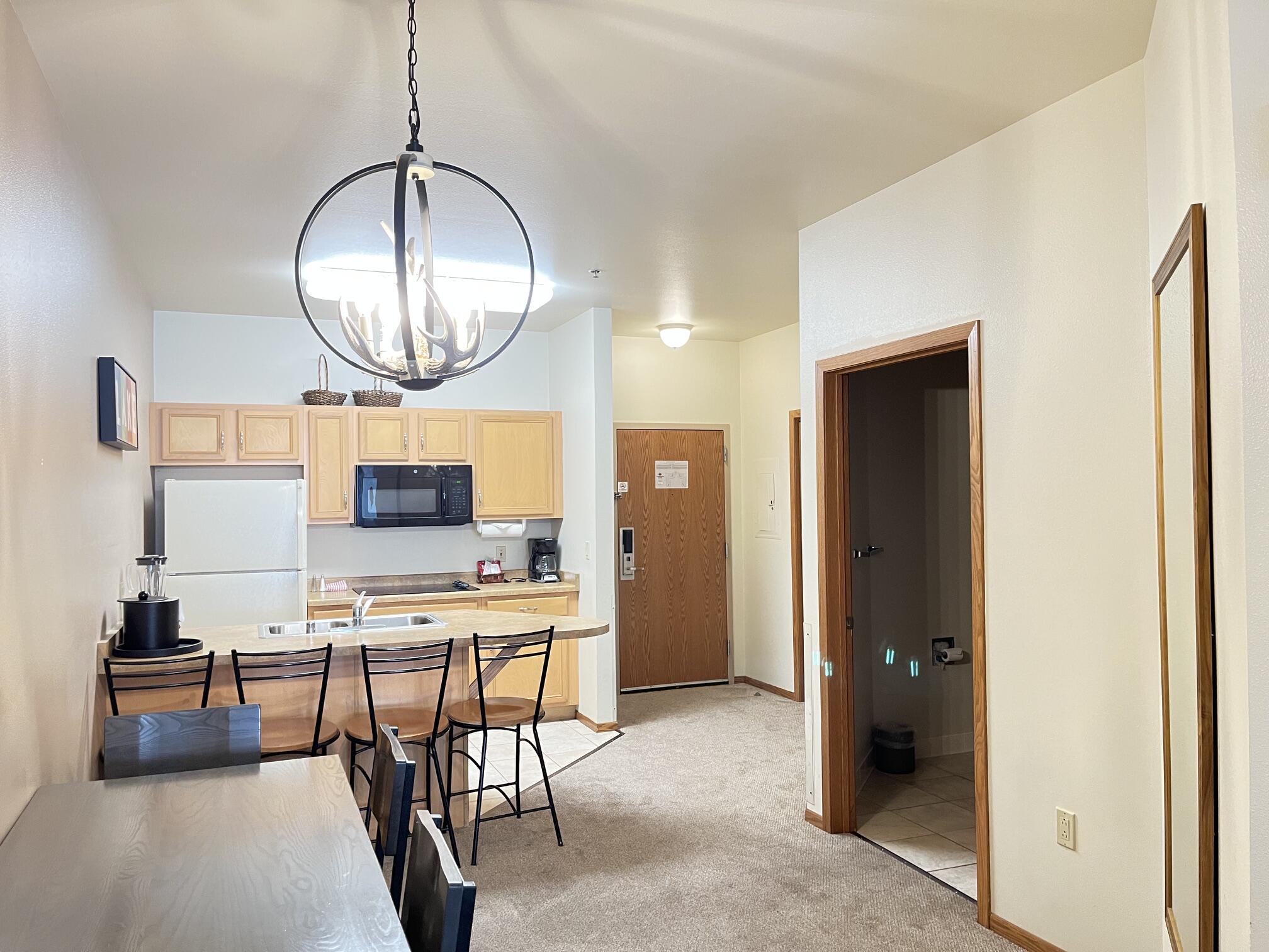 Undisclosed Address Lyons, WI 53147 - Photo 11 of 17 Dinette opens to eat-in kitchen and main entry. (door on right is full bath) Table & chairs included.