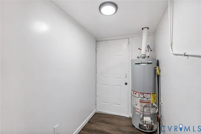a view of walk in closet with wooden floor
