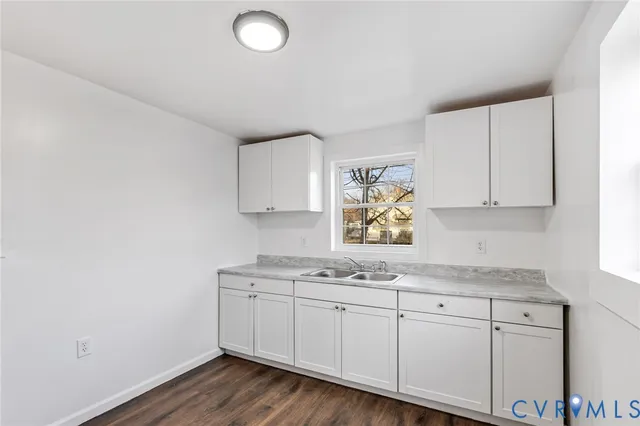 a view of cabinets with wooden floor