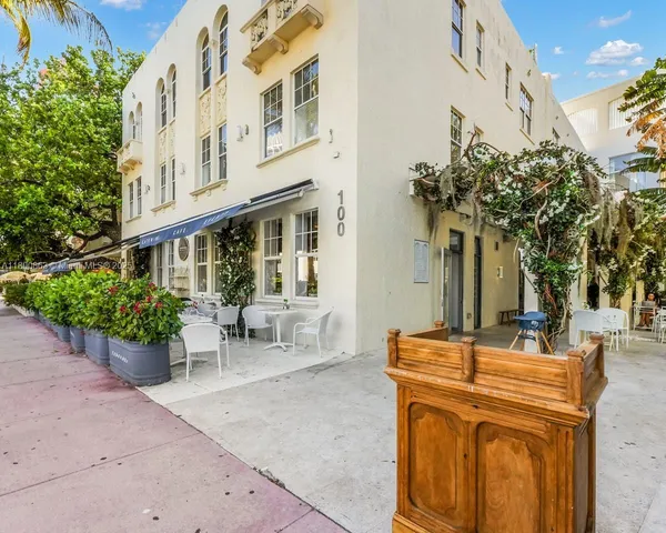 a view of a building with sitting area