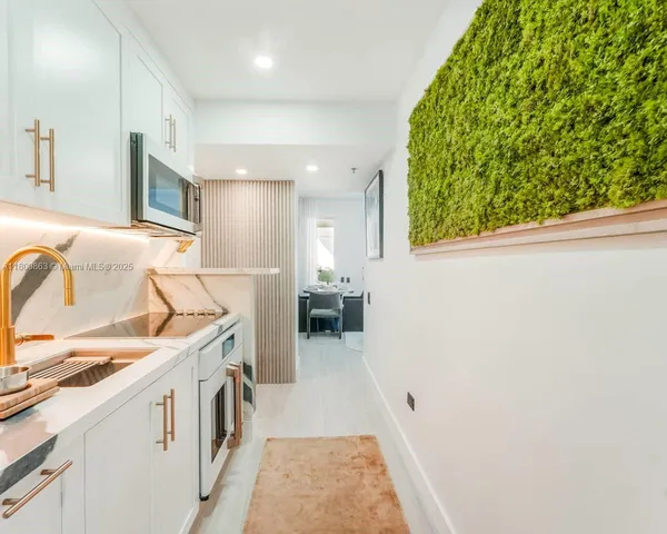 a kitchen with a sink and a stove top oven