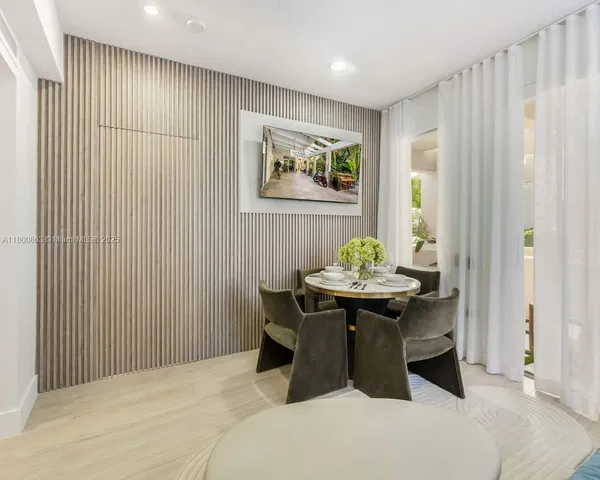 a dining room with a table and chairs