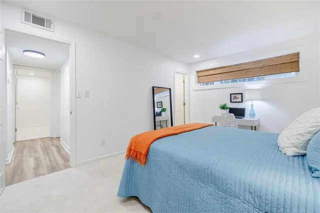 a bedroom with a bed and a walk in closet