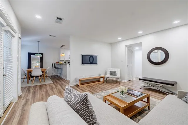 a living room with furniture rug and window