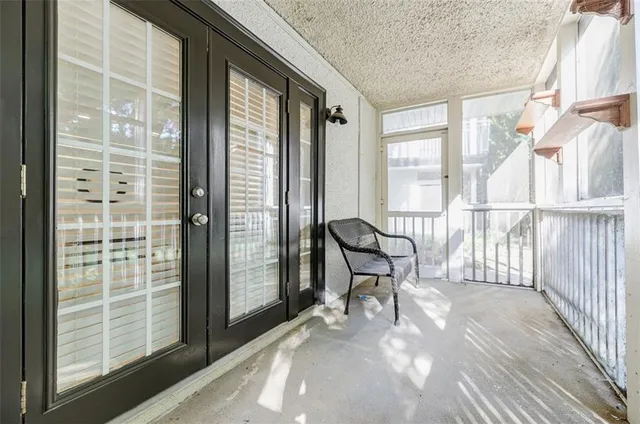 a view of a room with wooden floor and chair