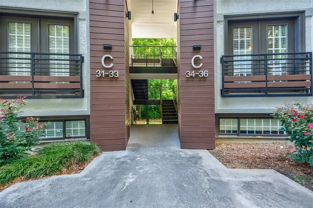 a view of a brick house with a large windows