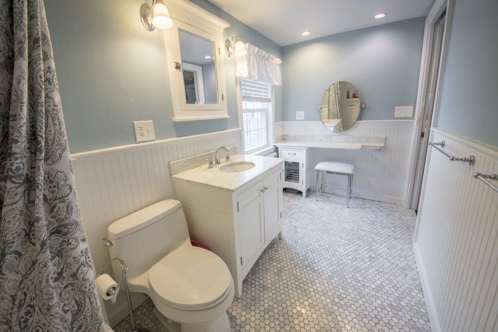16 Latin Road Boston, MA 02132 - Photo 14 of 26 a bathroom with a toilet sink and mirror