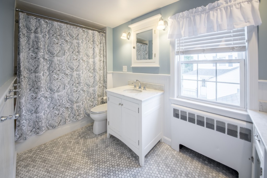 16 Latin Road Boston, MA 02132 - Photo 15 of 26 a bathroom with a sink toilet and shower