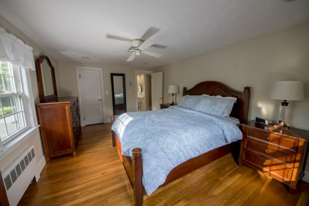 16 Latin Road Boston, MA 02132 - Photo 19 of 26 a bedroom with a bed and wooden floor