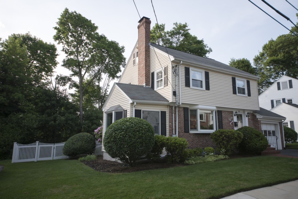 16 Latin Road Boston, MA 02132 - Photo 24 of 26 a front view of a house with a garden and plants