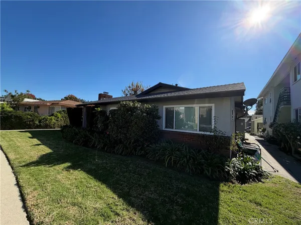 a view of house with garden space and street view