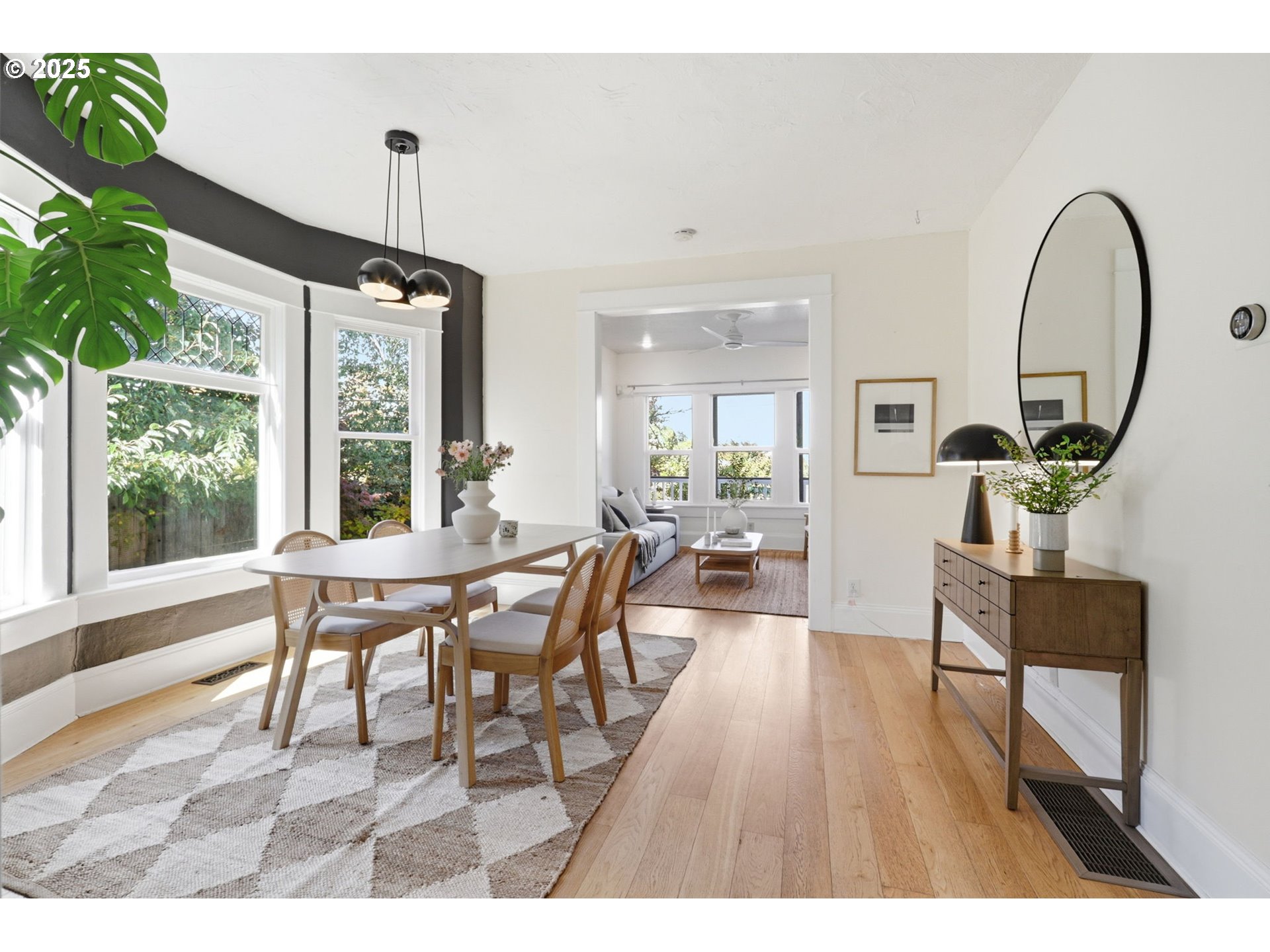 954 Northeast Emerson Street Portland, OR 97211 - Photo 14 of 47 a view of a dining room with furniture window and wooden floor