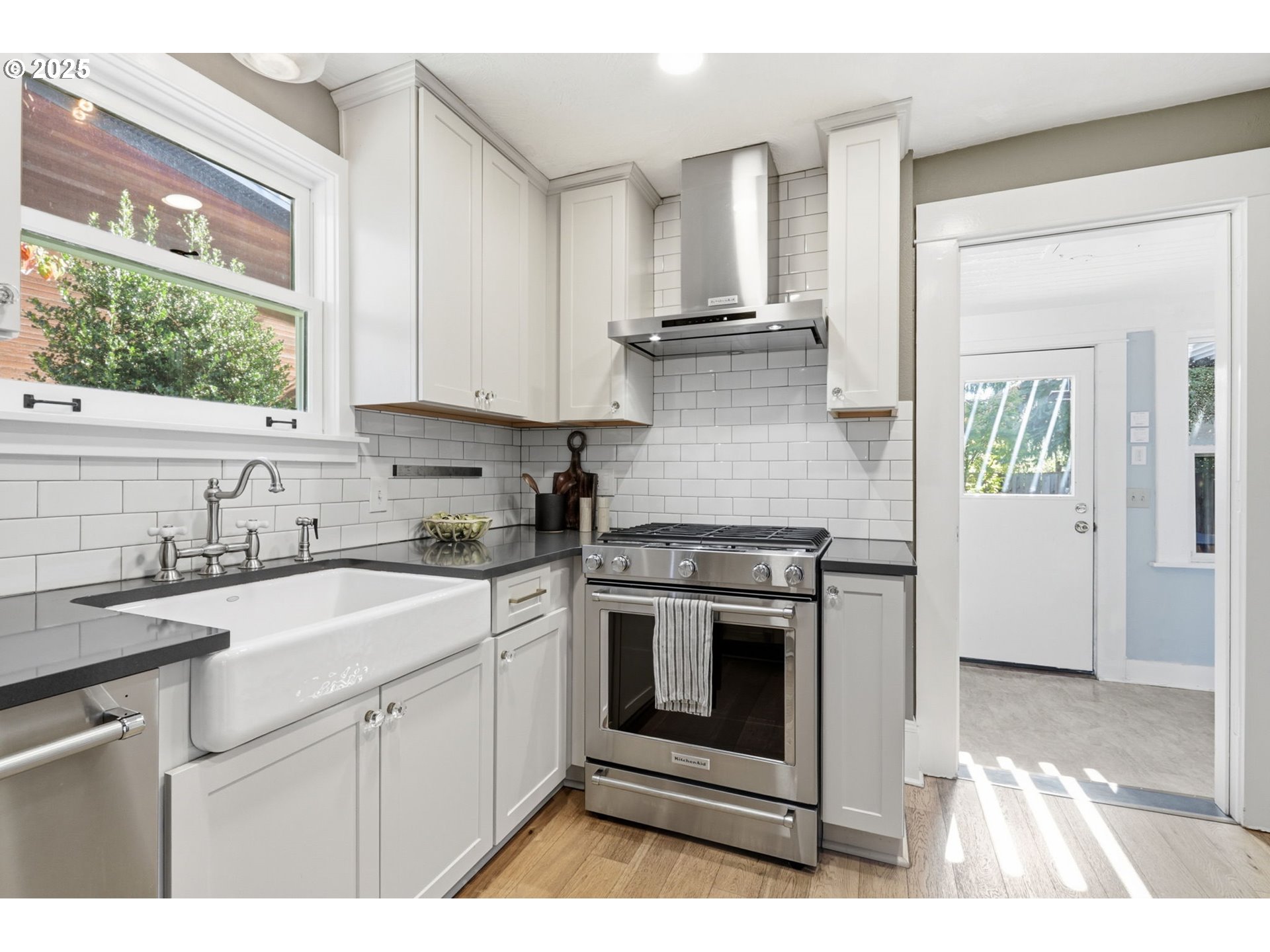 954 Northeast Emerson Street Portland, OR 97211 - Photo 20 of 47 a kitchen with appliances cabinets and a sink
