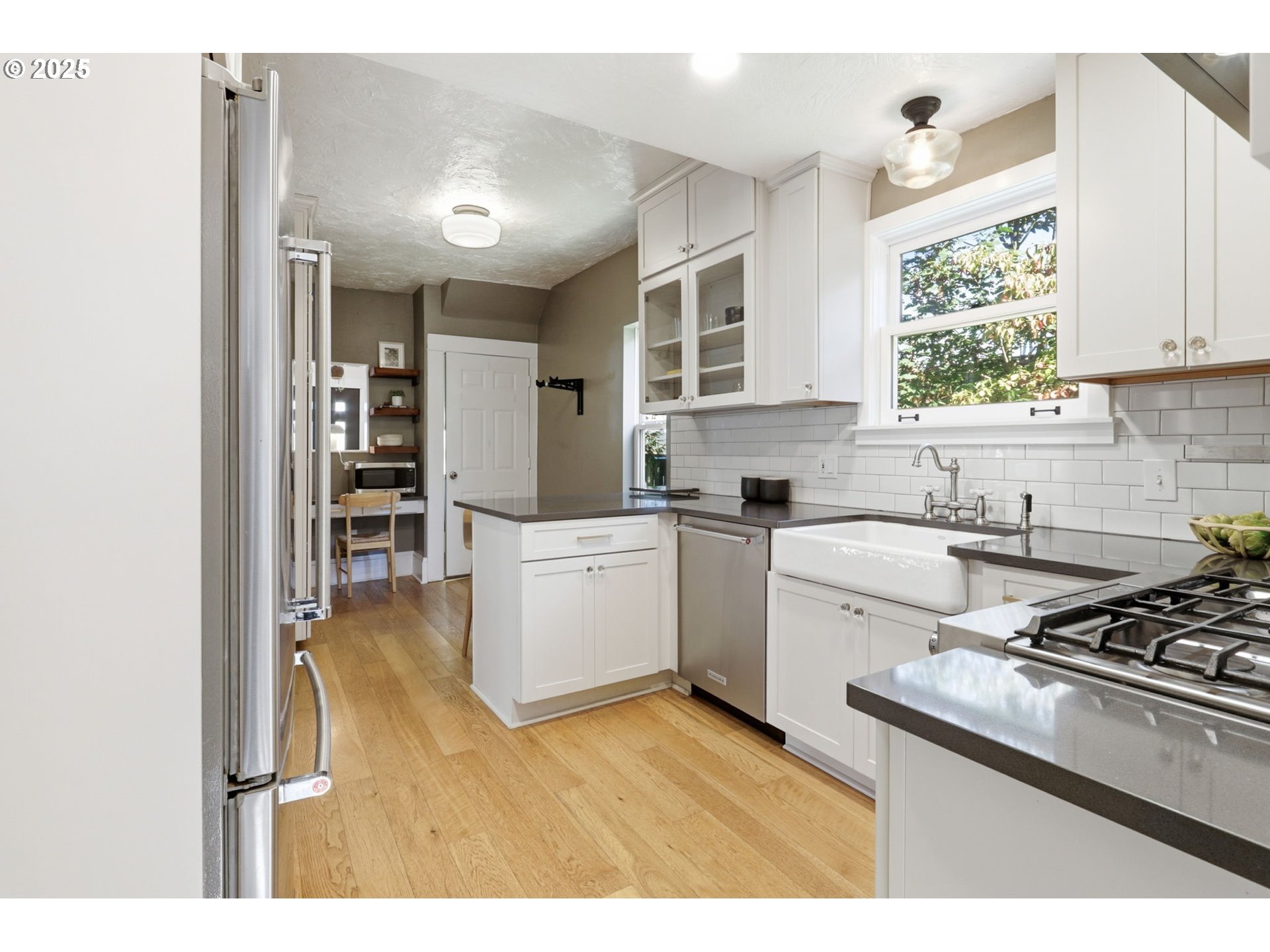 954 Northeast Emerson Street Portland, OR 97211 - Photo 23 of 47 a kitchen with a stove cabinets and a window