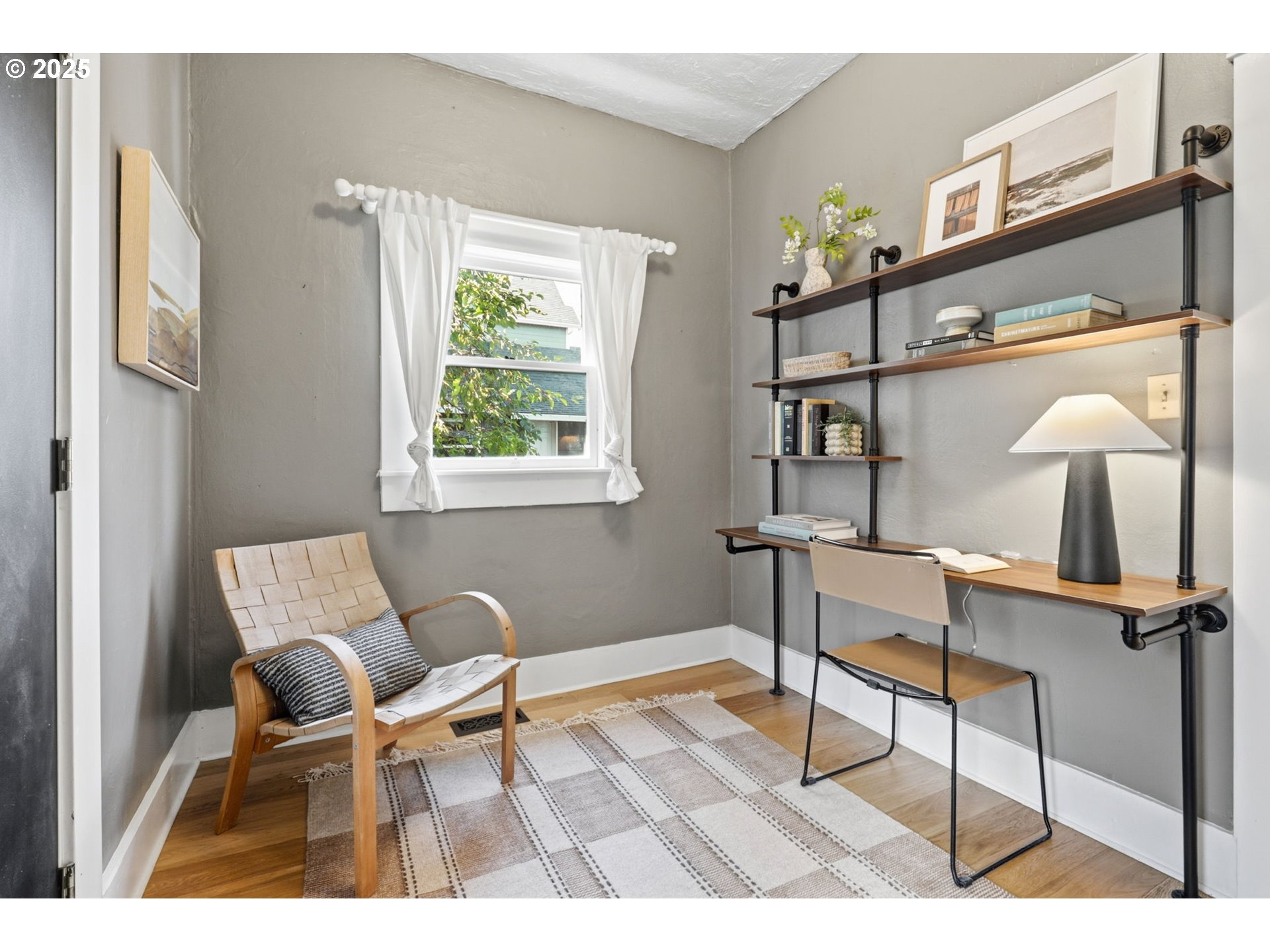 954 Northeast Emerson Street Portland, OR 97211 - Photo 25 of 47 a living room with furniture and a window